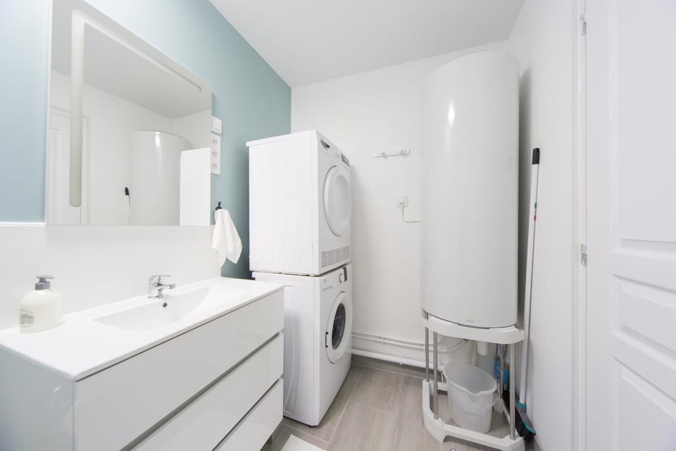 Toilet, Bathroom, hair dryier, towels, washing machine, dryer
