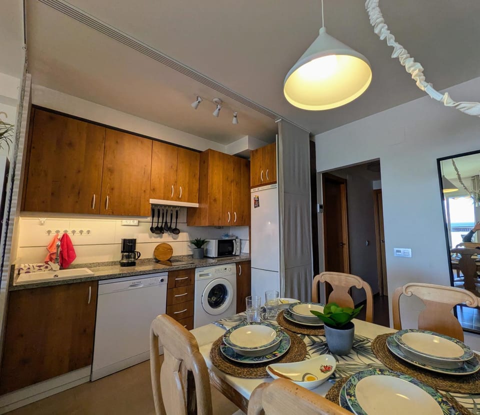 Kitchen or kitchenette, dishwasher, microwave, stove, washing machine