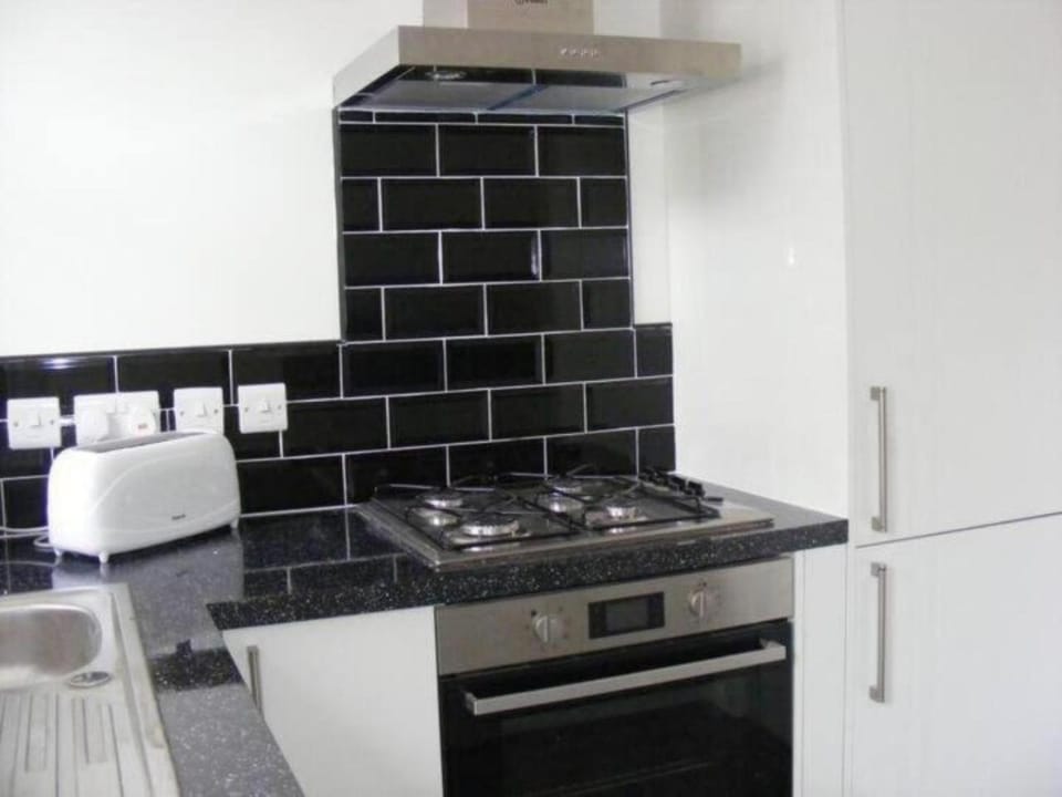 Kitchen or kitchenette, stove, toaster