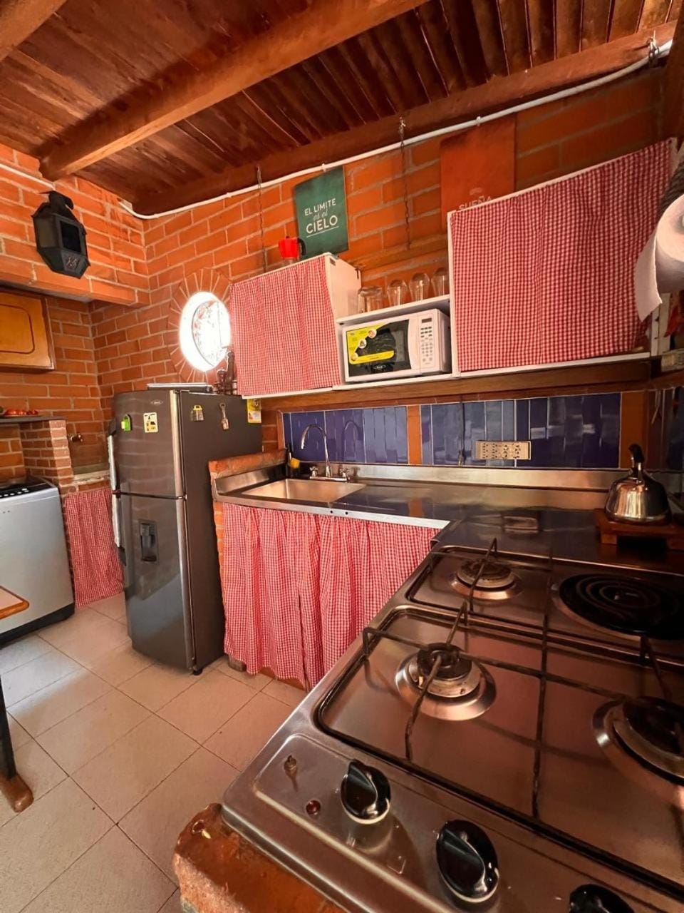 Kitchen or kitchenette, microwave, stove, laundry