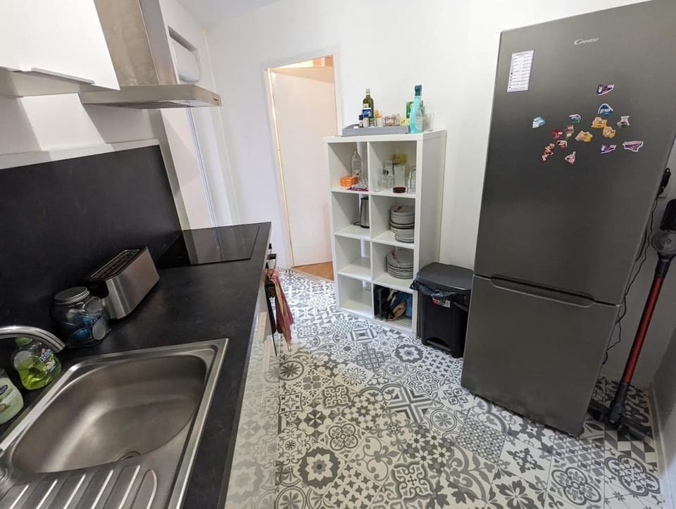 Kitchen or kitchenette, dishwasher, oven, stove