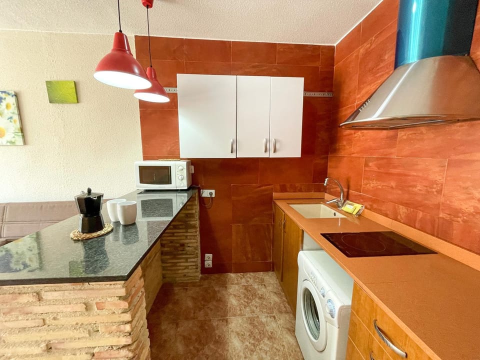 Kitchen or kitchenette, oven, stove, washing machine