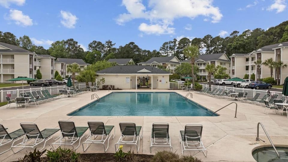 Property building, Patio, Spring, Day, Pool view, Swimming pool, Parking, sunbed