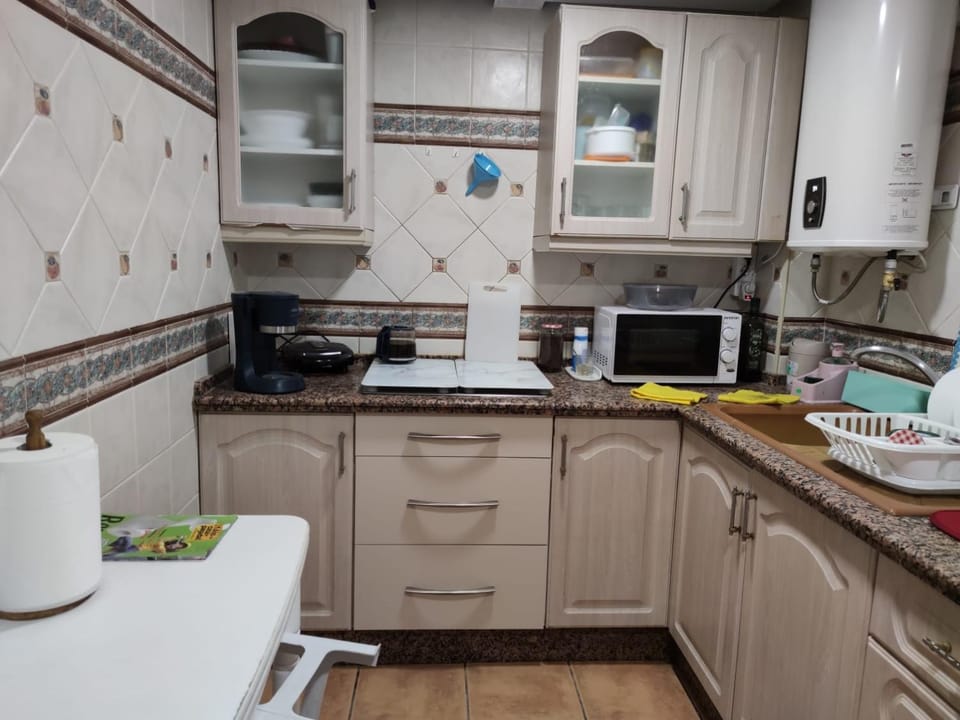 Kitchen or kitchenette, stove, toaster