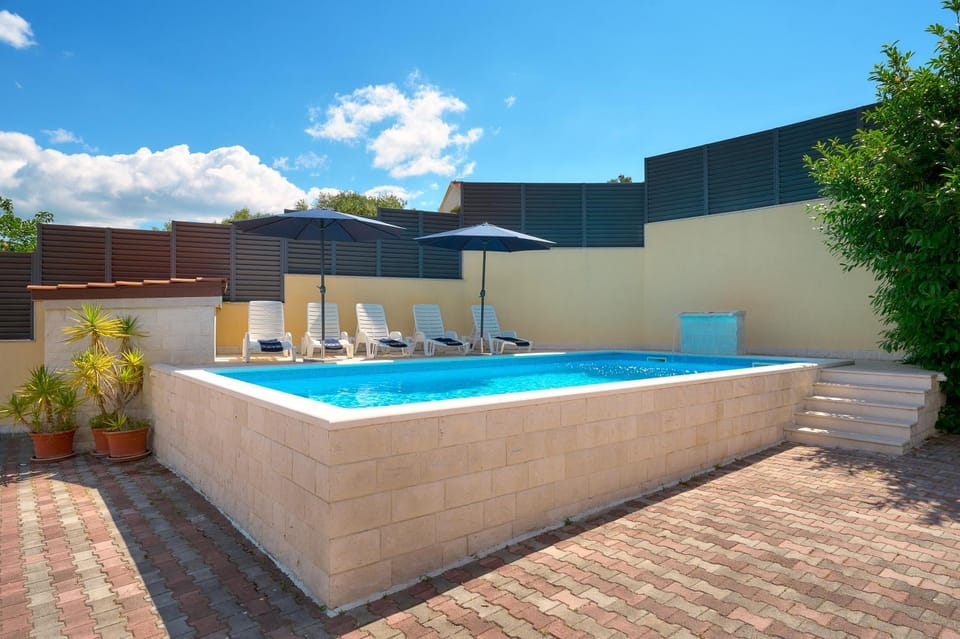 Patio, Day, Pool view, Swimming pool, sunbed