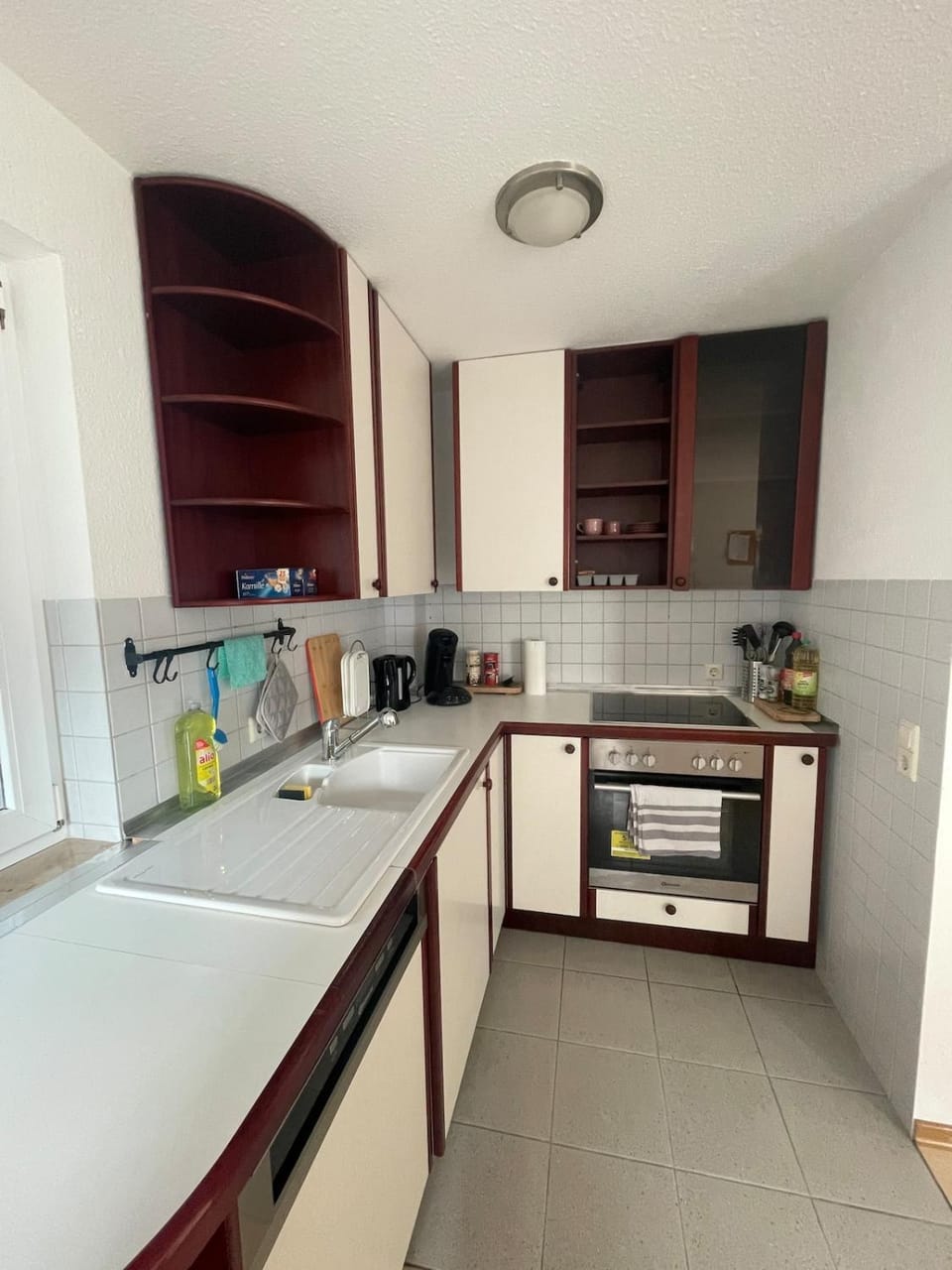 Kitchen or kitchenette, dishwasher, oven, stove
