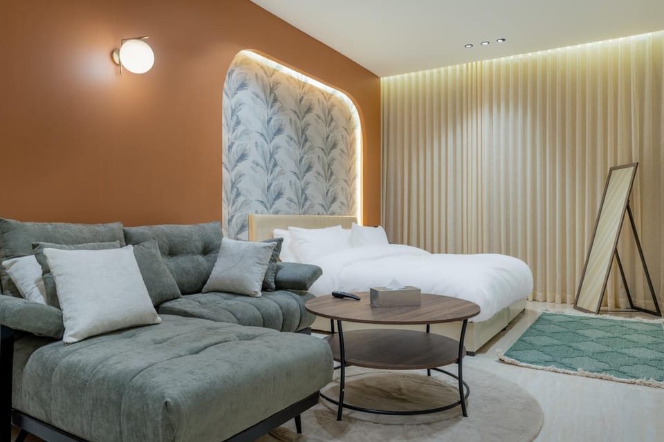 Bed, Living room, Seating area, Bedroom