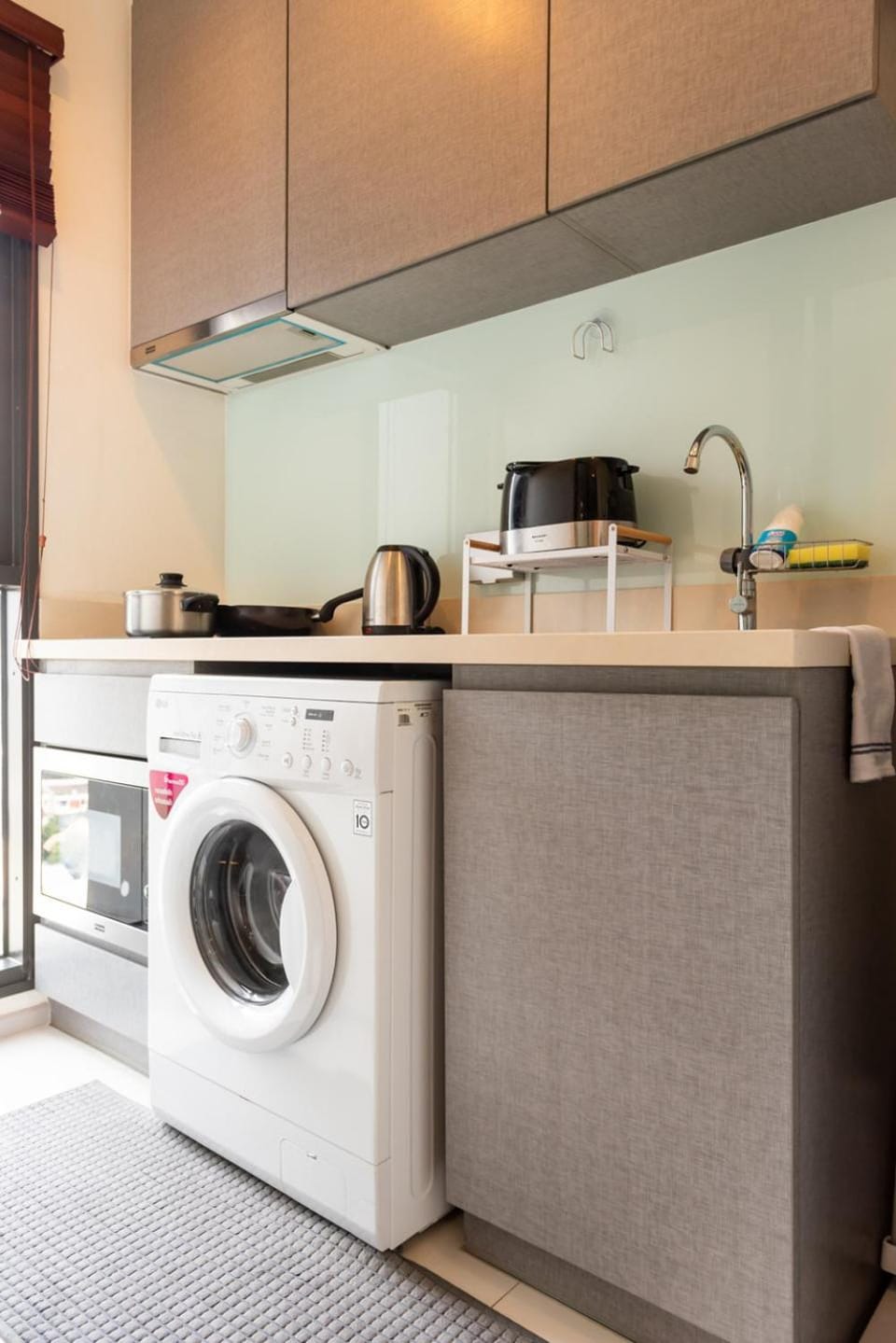 Kitchen or kitchenette, oven, stove, toaster, washing machine
