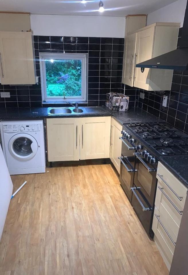 Kitchen or kitchenette, dishwasher, oven, stove, washing machine, dryer