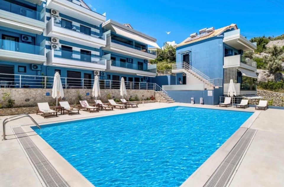 Property building, Patio, Pool view, Swimming pool, sunbed