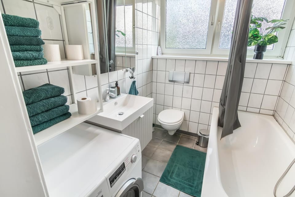 Toilet, Bathroom, Bath, hair dryier, towels, washing machine, dryer