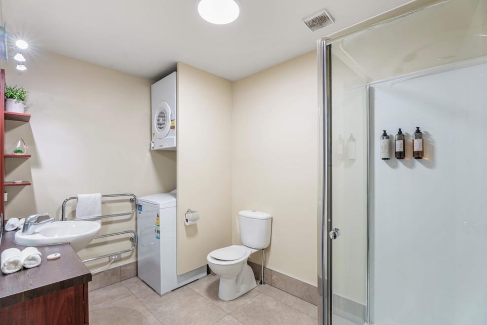Shower, Toilet, Bathroom, towels, washing machine, dryer