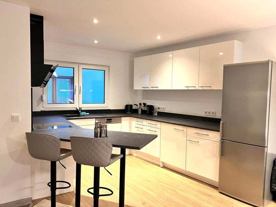 Kitchen or kitchenette, dishwasher, oven, stove