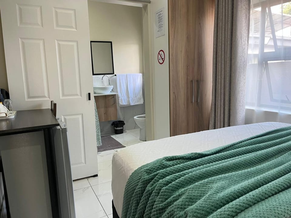 Bed, Bathroom, towels, wardrobe