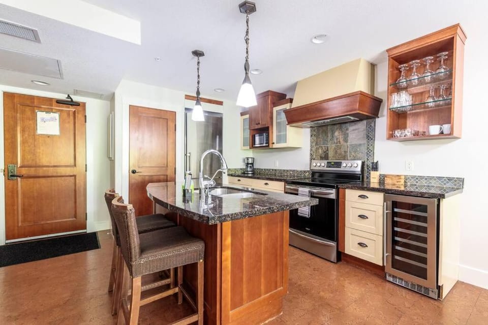 Kitchen or kitchenette, dishwasher, oven, stove