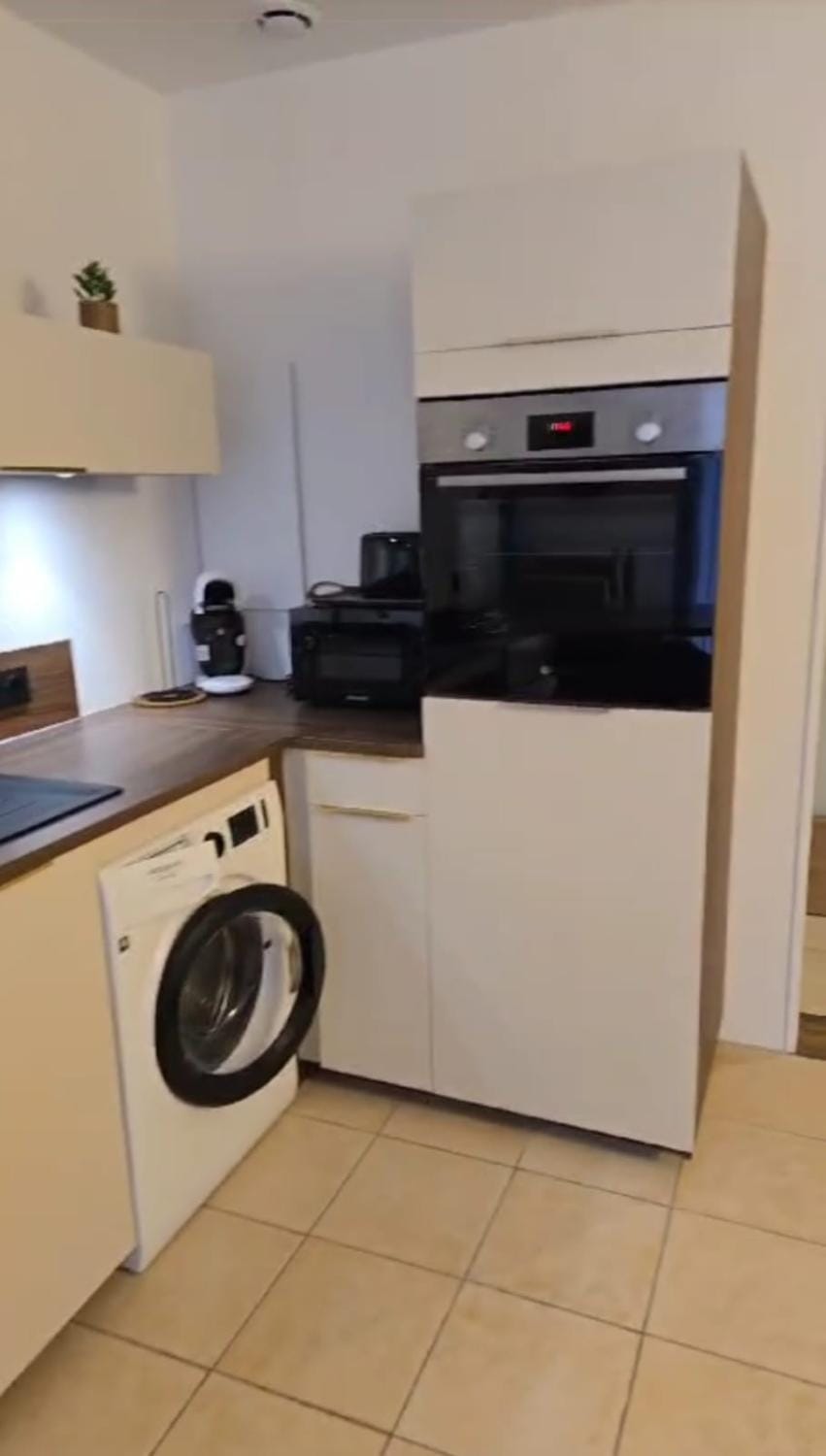Kitchen or kitchenette, dishwasher, oven, stove, washing machine