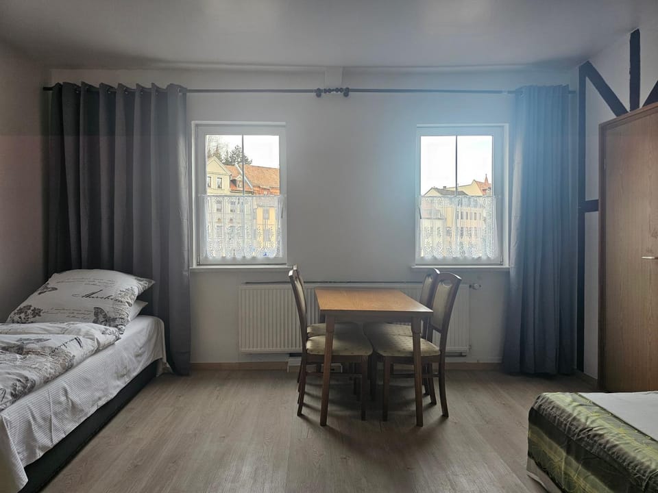 Bed, Living room, Seating area, Dining area