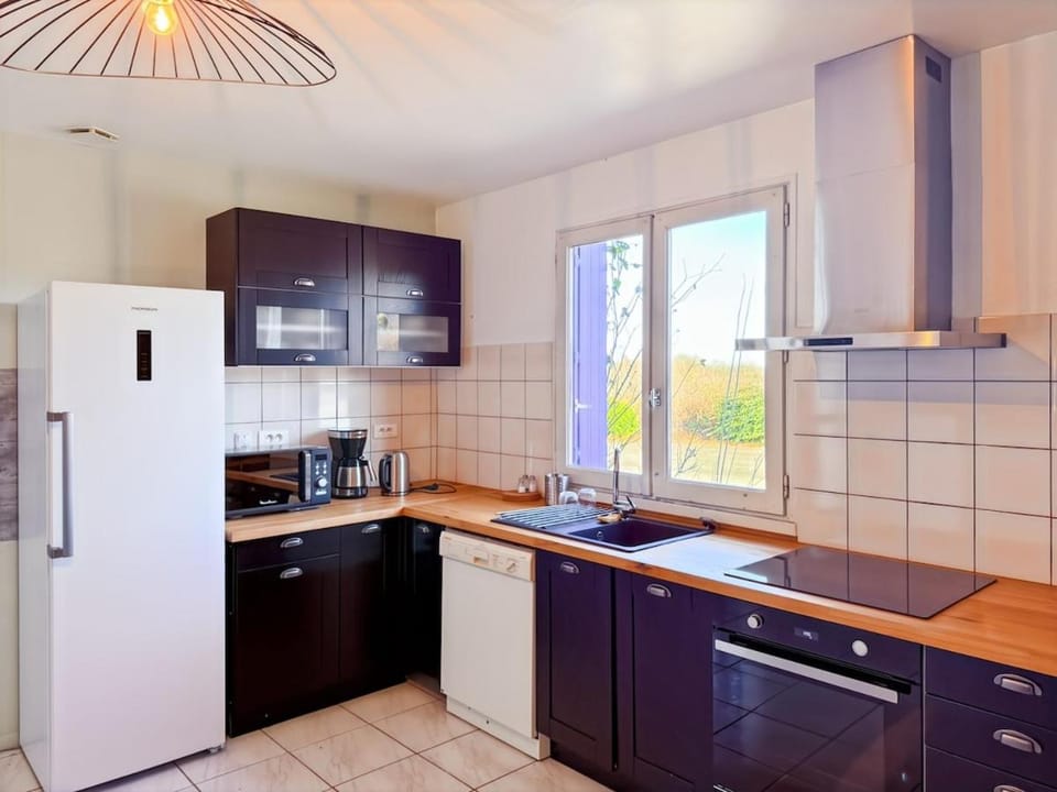 Kitchen or kitchenette, dishwasher, oven, stove, toaster