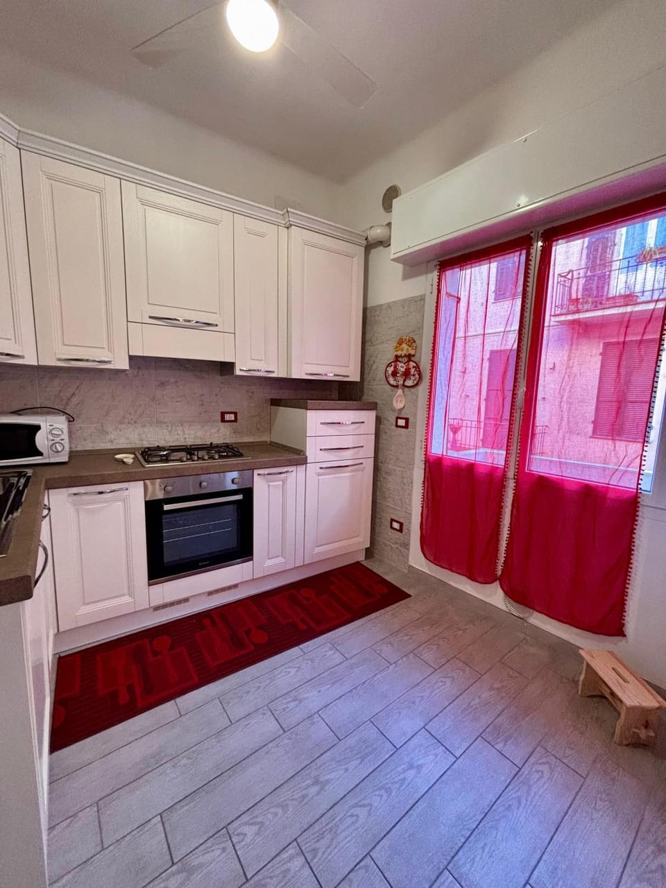 Kitchen or kitchenette, dishwasher, oven, stove