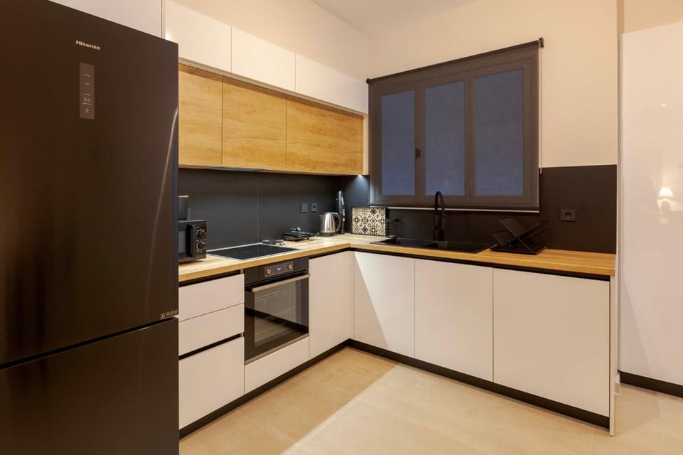 Kitchen or kitchenette, dishwasher, oven, stove