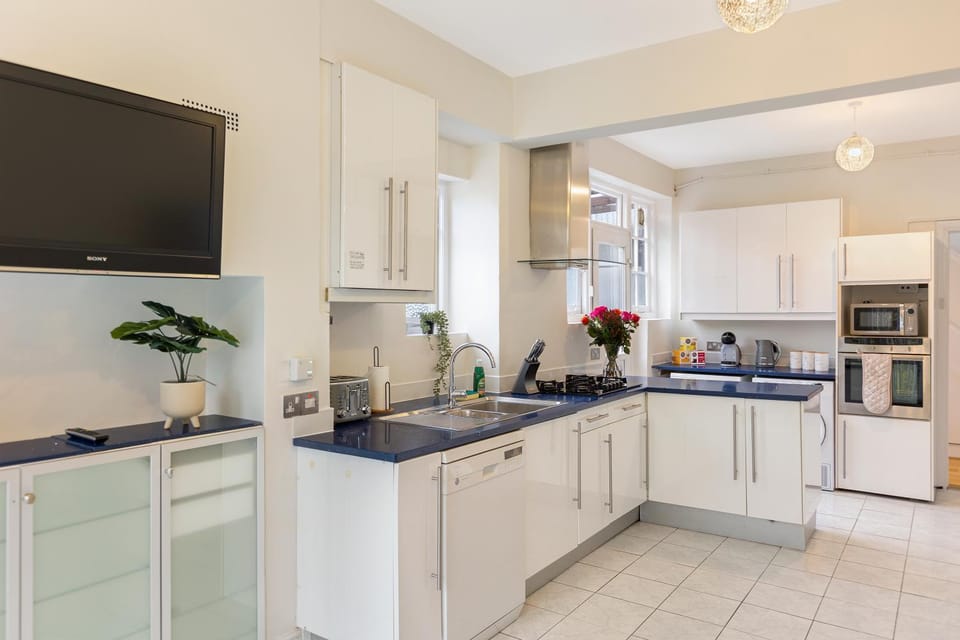 Kitchen or kitchenette, dishwasher, oven, stove, toaster
