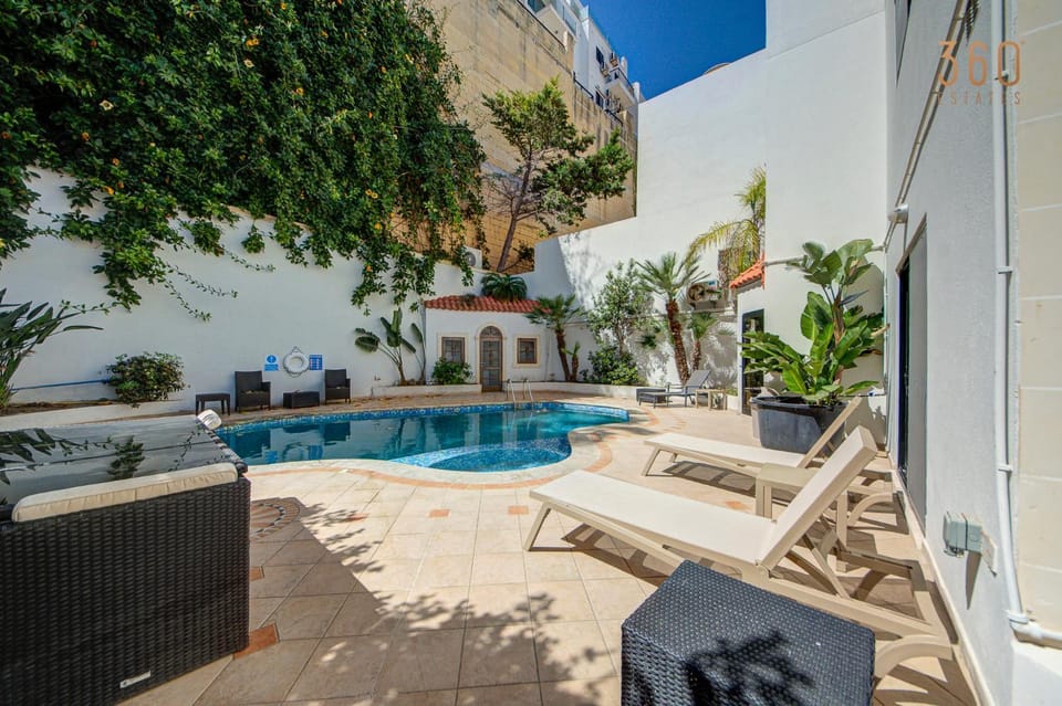 Property building, Day, Pool view, sunbed