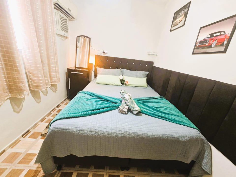 Bed, Photo of the whole room, Bedroom, towels, air conditioner