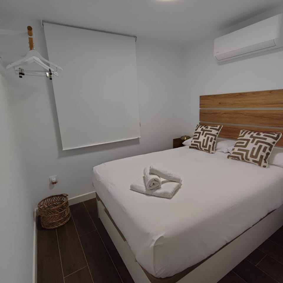 Bed, Photo of the whole room, Bedroom, towels, air conditioner