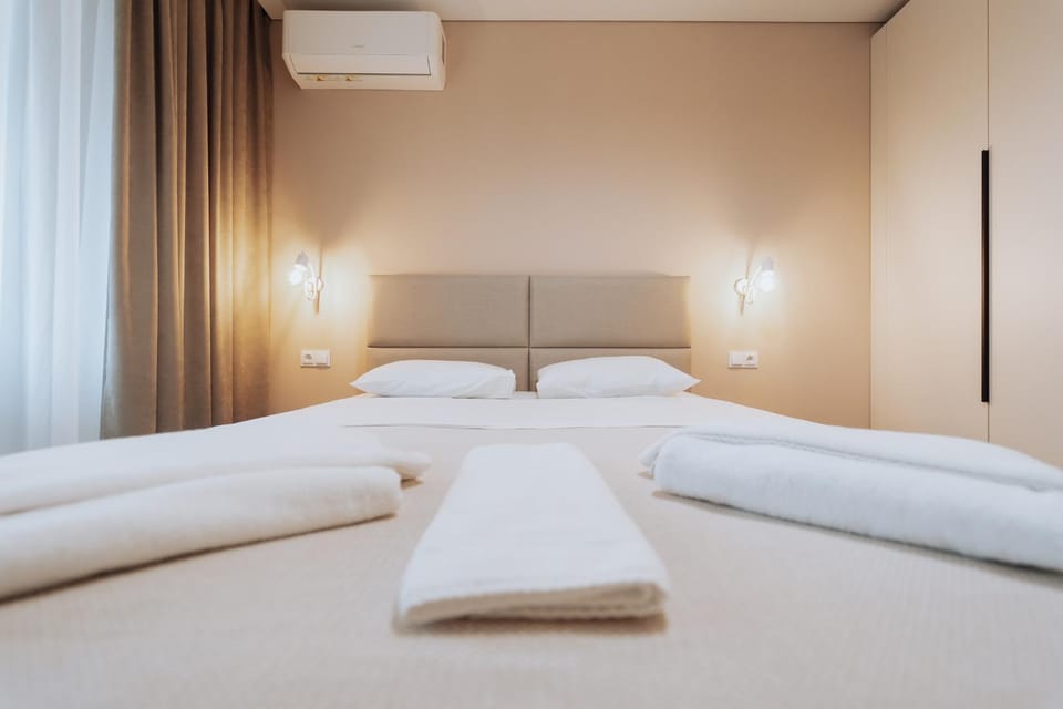 Bed, Bedroom, towels, wardrobe, air conditioner