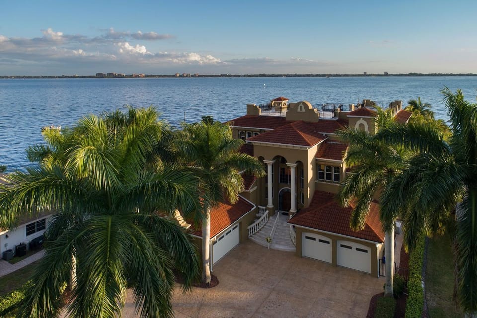 The Winslet Estate offers 5BR luxury, waterfront views, pool, spa, and game room - SWFL Rentals Villa in Cape Coral