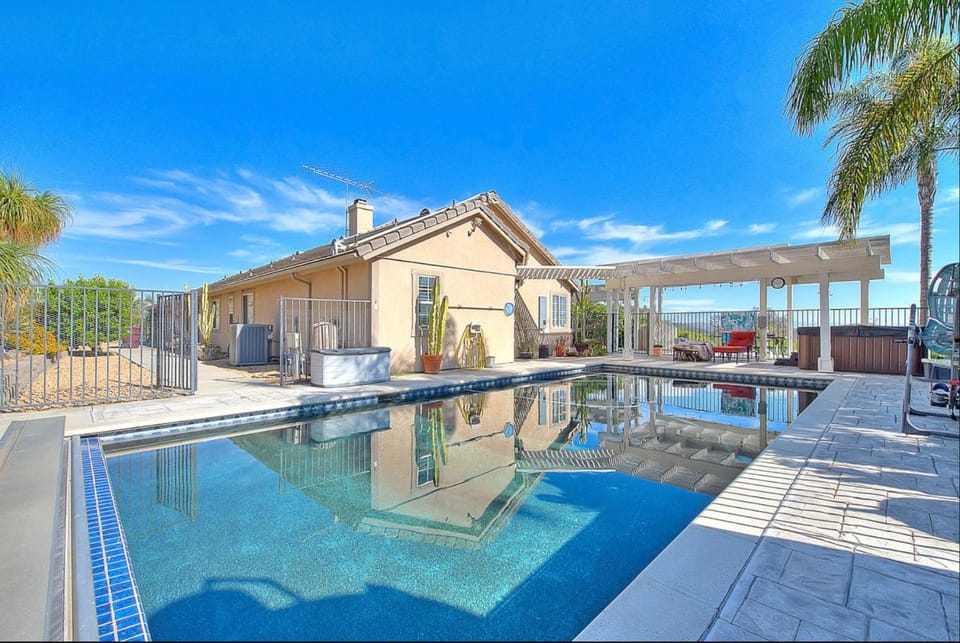 Property building, Patio, Pool view, Swimming pool, sunbed