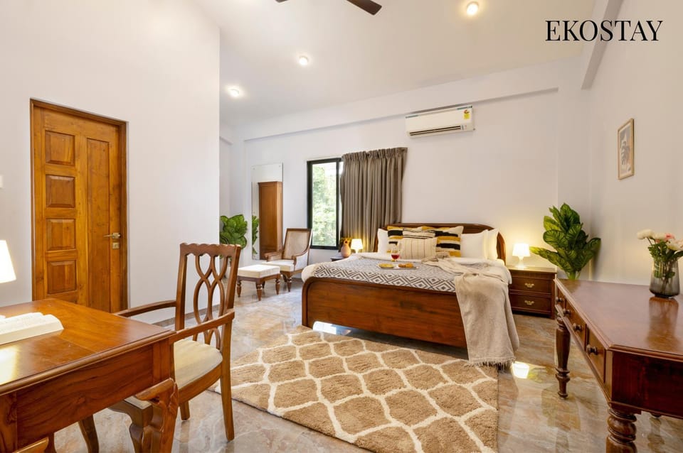 Bed, Photo of the whole room, Seating area, Bedroom, Text overlay, air conditioner