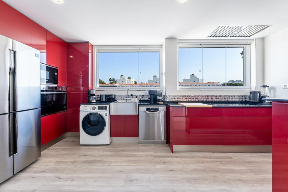 Kitchen or kitchenette, dishwasher, oven, stove, toaster, washing machine