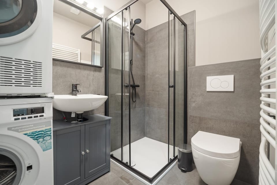 Shower, Toilet, Bathroom, towels, washing machine, dryer
