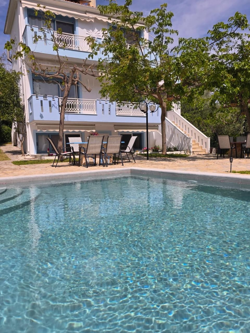 Property building, Patio, Day, Pool view, Swimming pool