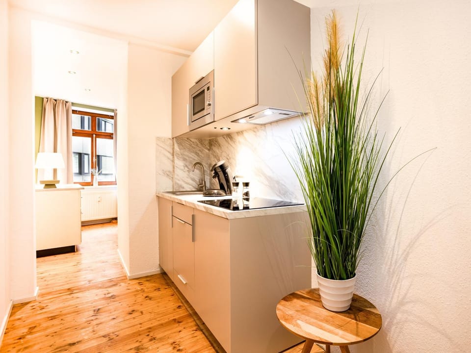 Kitchen or kitchenette, dishwasher, microwave, stove