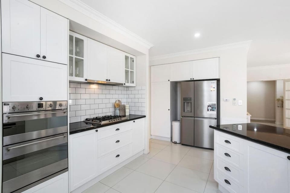Kitchen or kitchenette, dishwasher, oven, stove