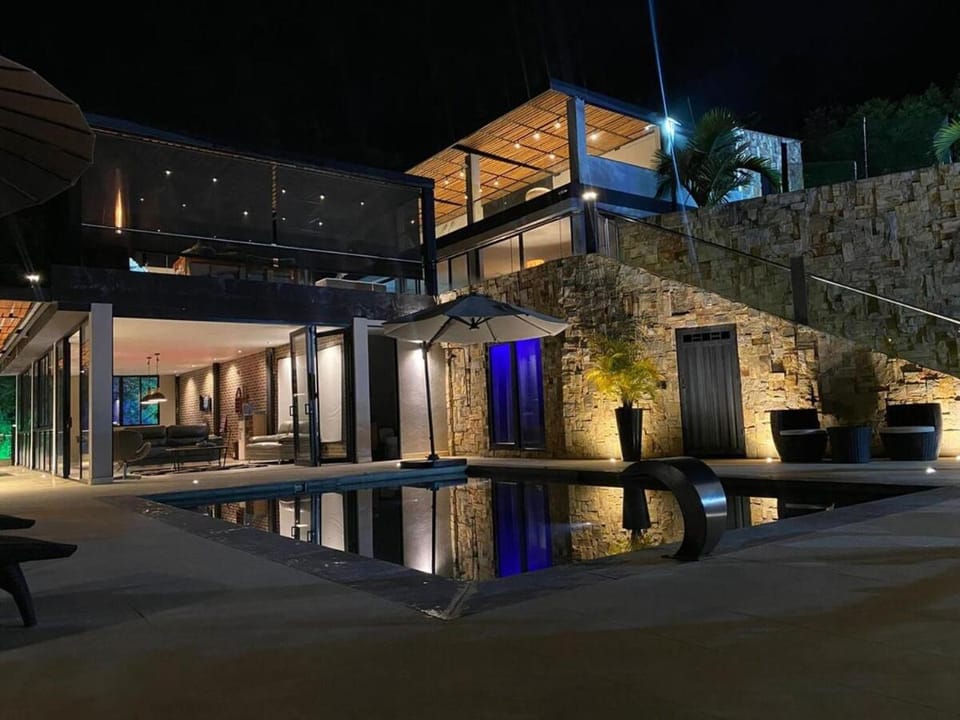 Property building, Patio, Night, Pool view, Swimming pool
