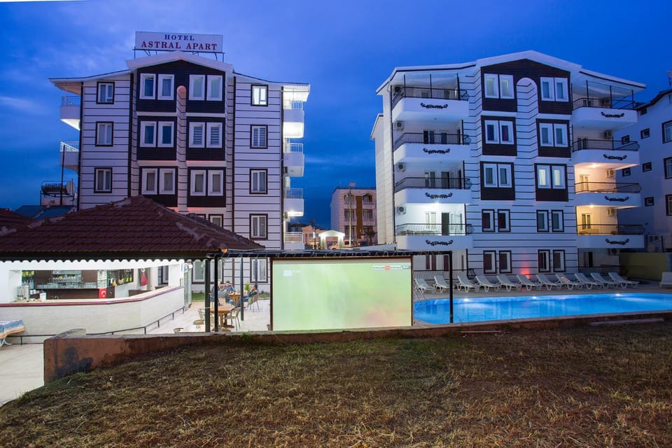 Property building, Patio, Night, Pool view, Swimming pool, sunbed
