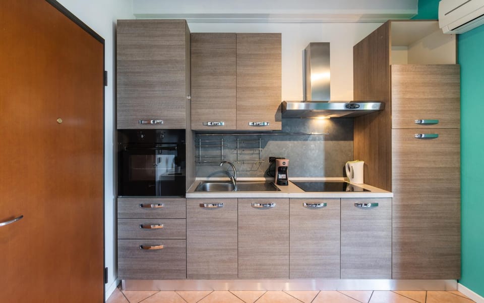 Kitchen or kitchenette, dishwasher, oven, stove