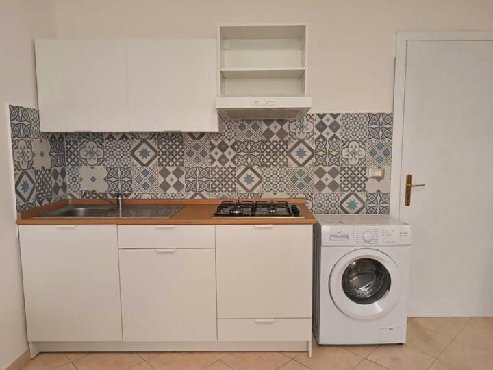 Kitchen or kitchenette, stove, washing machine