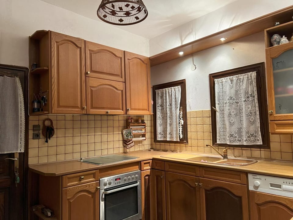 Kitchen or kitchenette, dishwasher, oven, stove