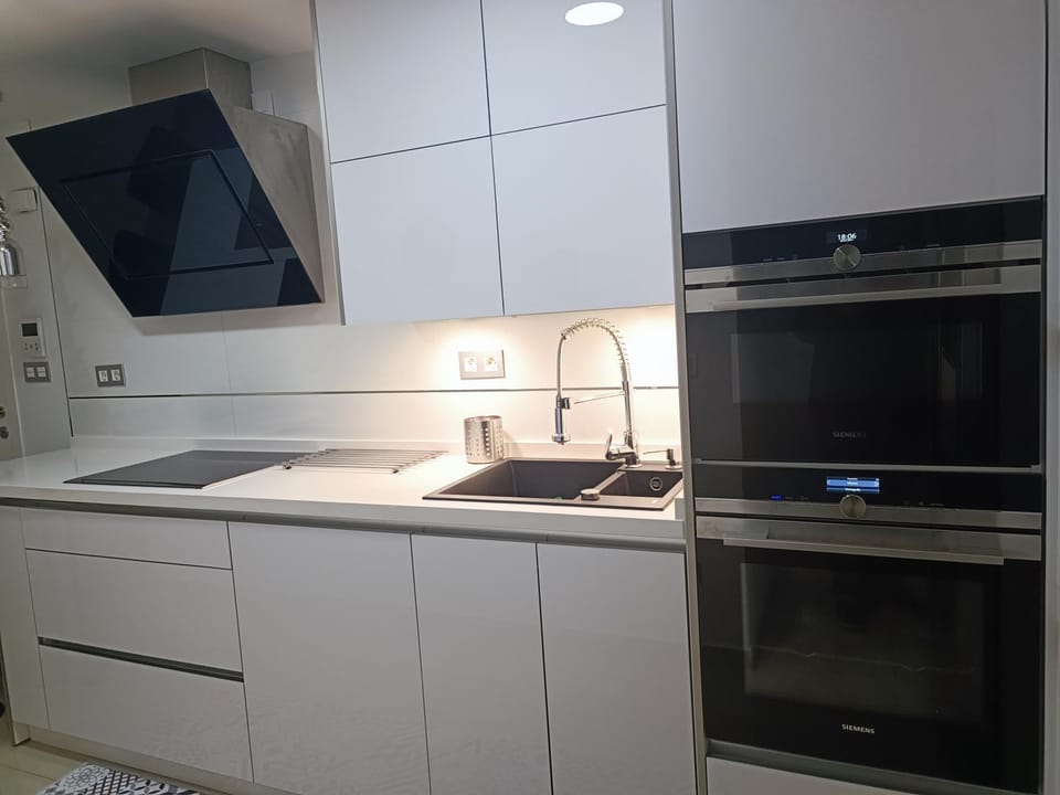 Kitchen or kitchenette, microwave, oven, stove, kitchen