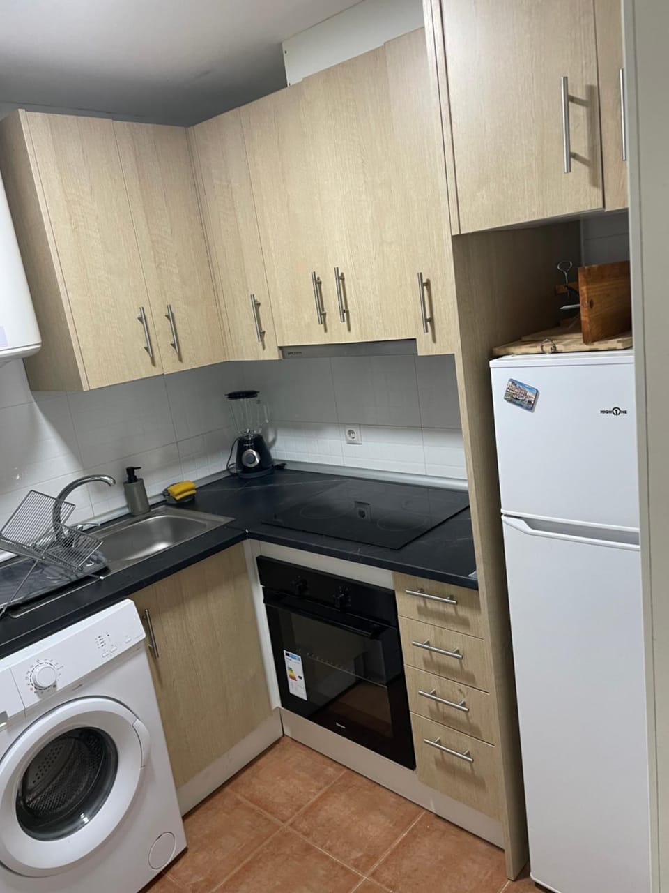 Kitchen or kitchenette, oven, stove, washing machine