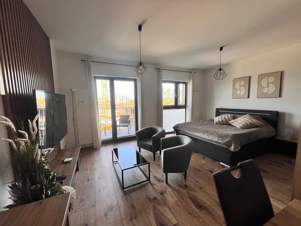 Bed, Living room, Seating area, Bedroom