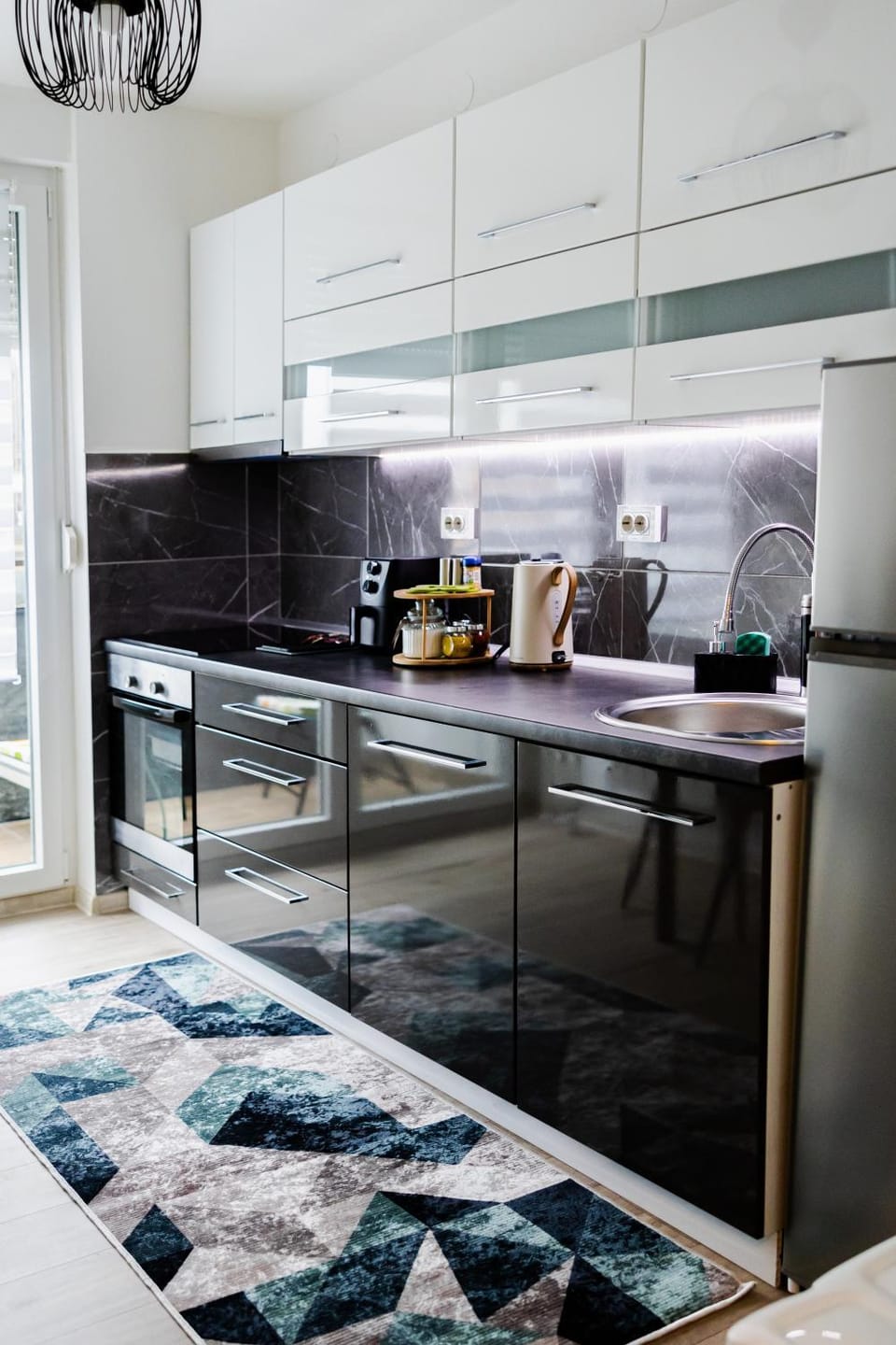 Kitchen or kitchenette, dishwasher, microwave, oven, stove