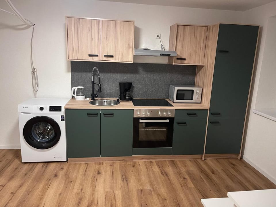Kitchen or kitchenette, washing machine