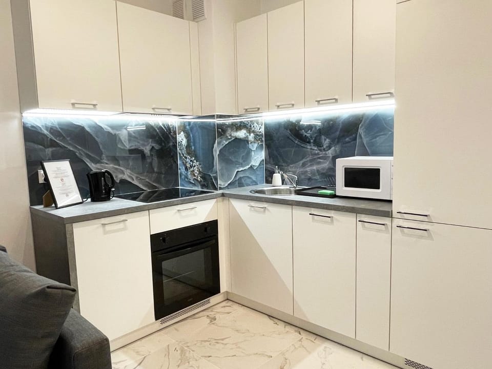 Kitchen or kitchenette, dishwasher, oven, stove