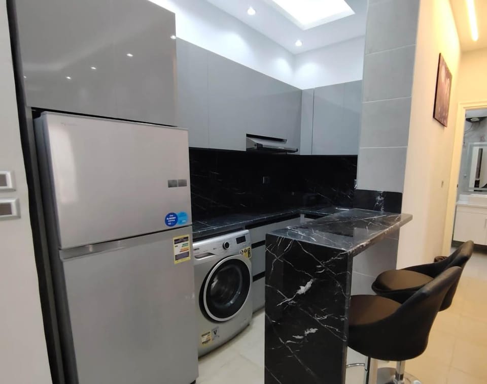 Kitchen or kitchenette, stove, washing machine