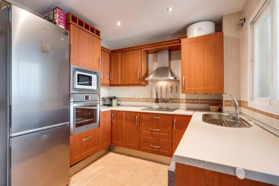 Kitchen or kitchenette, dishwasher, oven, stove, toaster